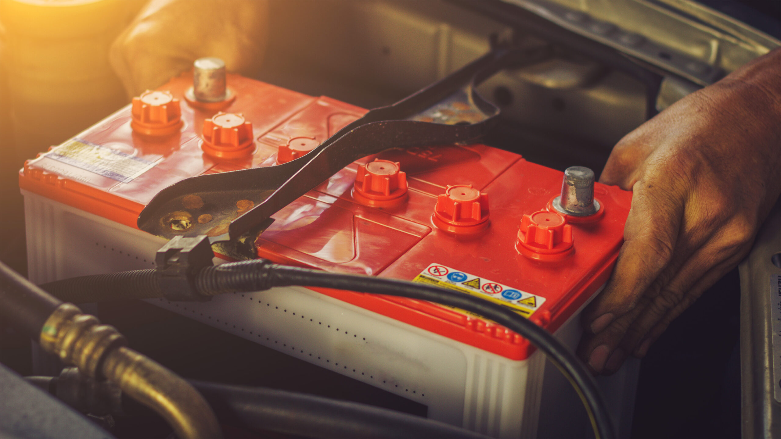 Mechanic replacing car battery