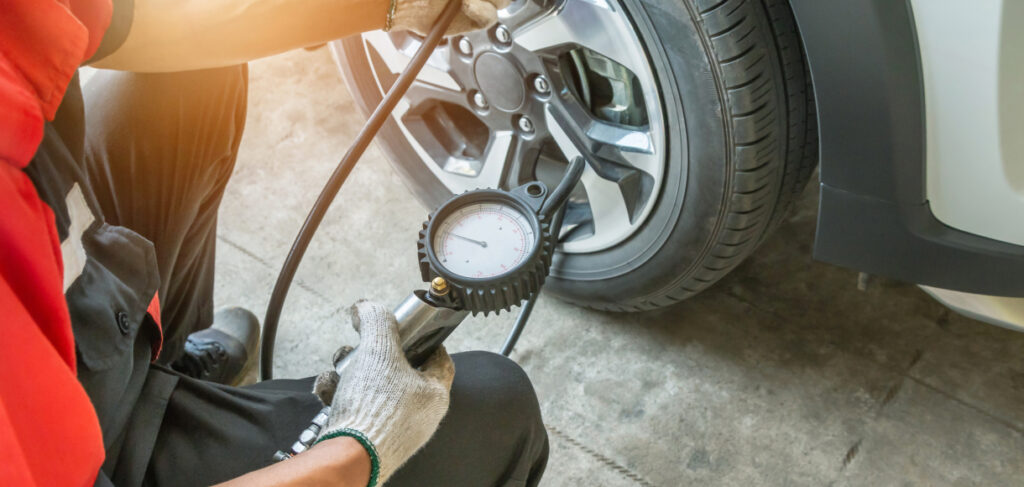 Mechanic doing maintenance on car tire